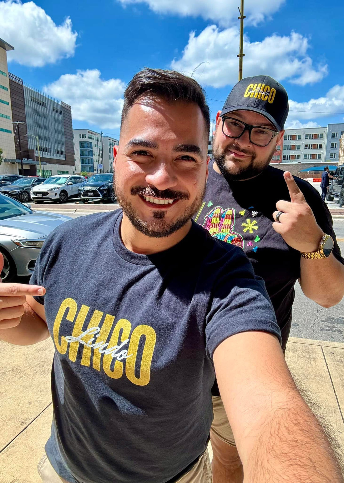 Armando Seledon and Melvin Obregon, co-founders of Chico Lindo, a Latino-owned business celebrating Chicano and RGV culture, standing together and showcasing their pride in Latino heritage.